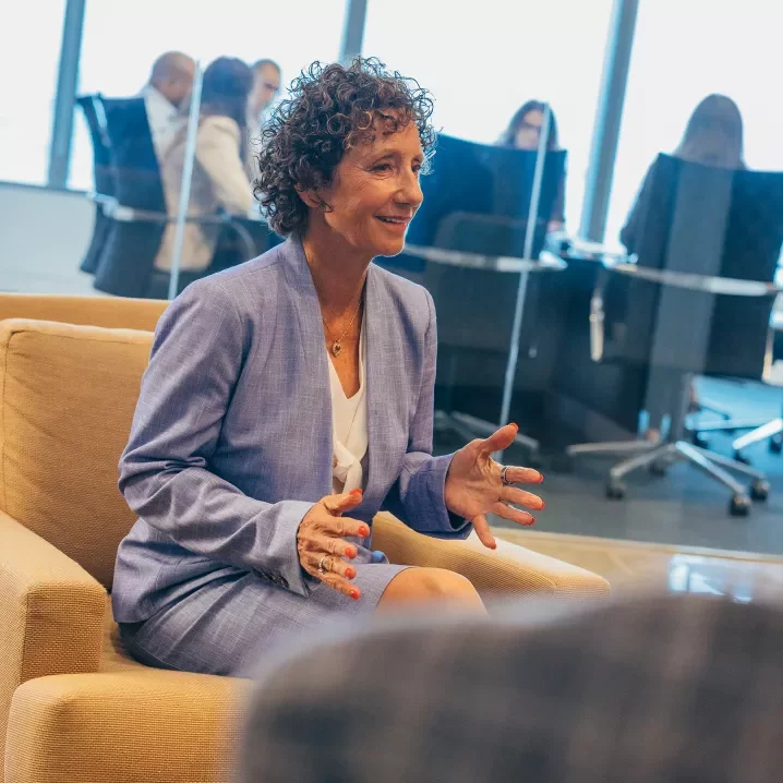 ms24 woman sitting talking outside conference room d1 01029.jpg