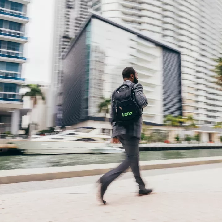 ms24 man carrying a littler backpack walking outside background blurred d1 01351.jpg