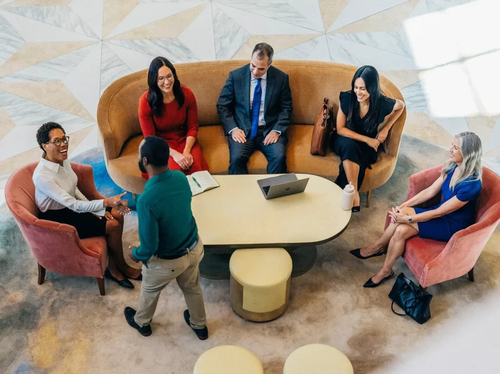 ms24 people in lobby around table meeting top view horizontal.jpg